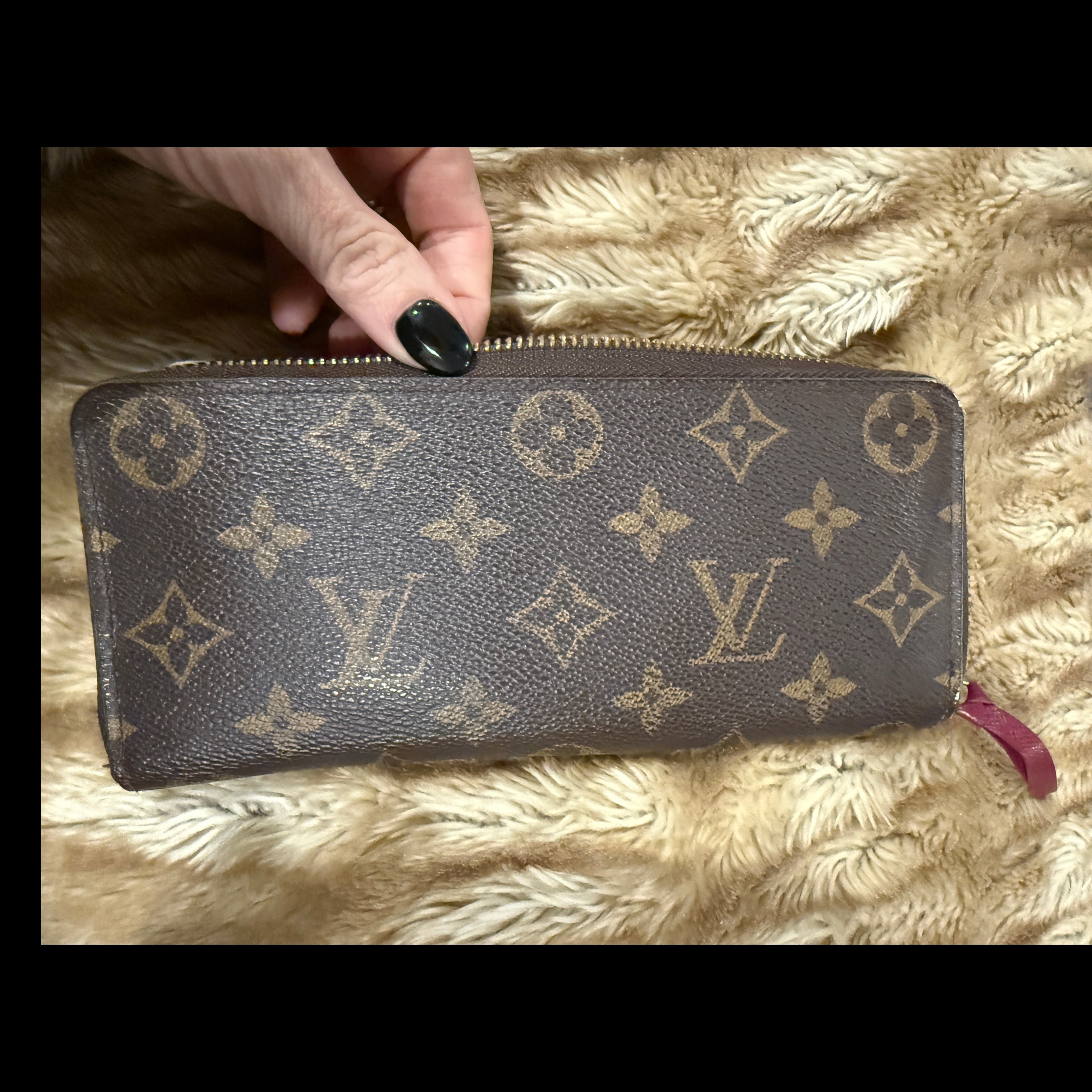 Louis Vuitton Zippy Wallet (Monogram Canvas) with a fuchsia/red interior.
