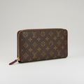 Louis Vuitton Zippy Wallet (Monogram Canvas) with a fuchsia/red interior.
