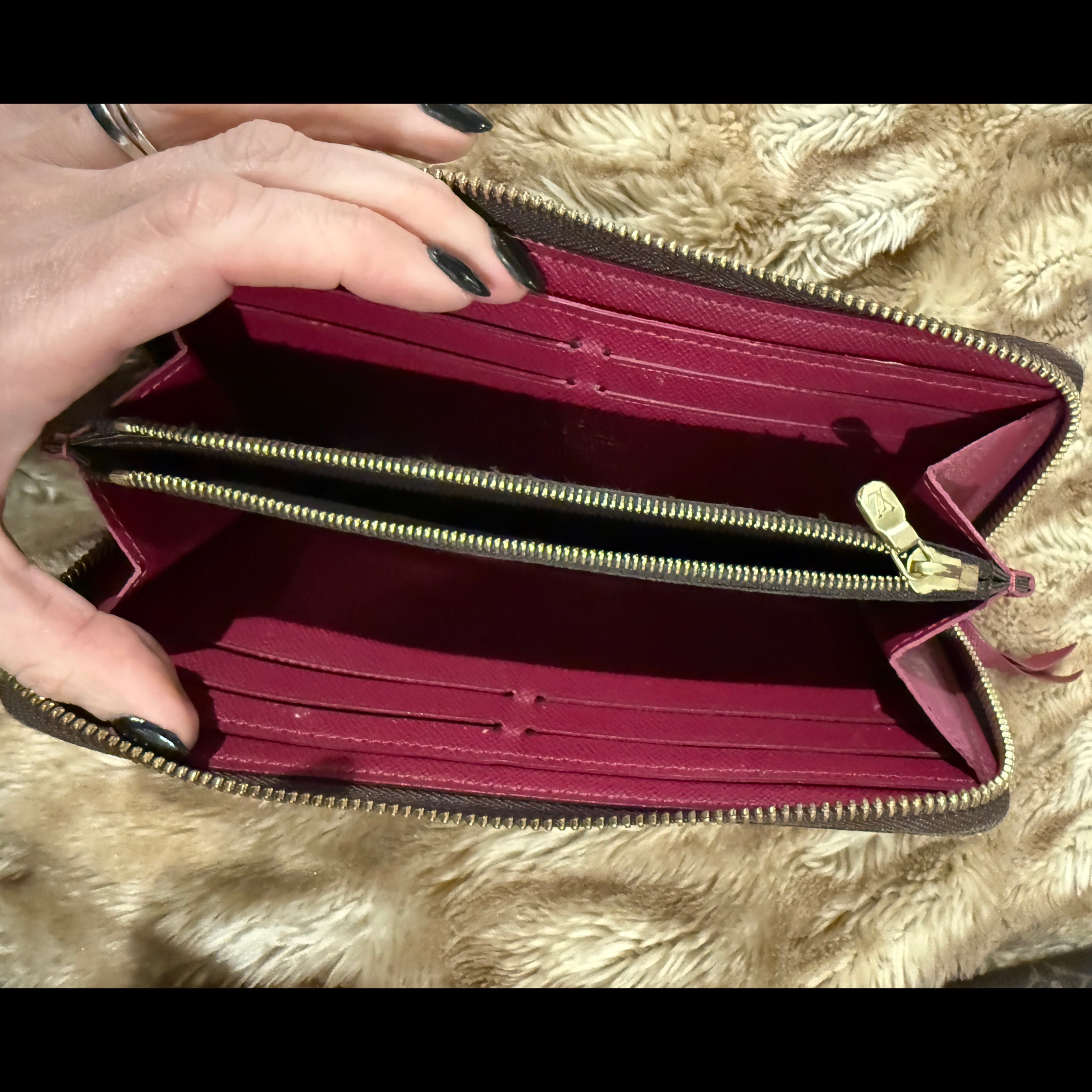 Louis Vuitton Zippy Wallet (Monogram Canvas) with a fuchsia/red interior.