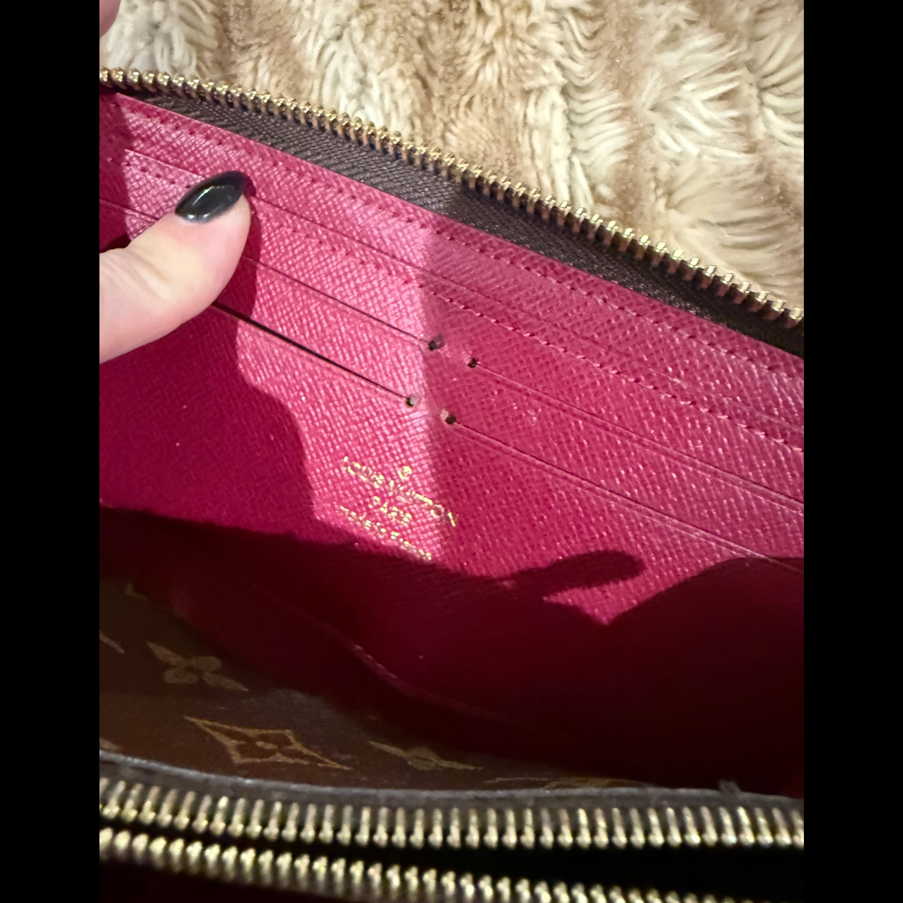 Louis Vuitton Zippy Wallet (Monogram Canvas) with a fuchsia/red interior.