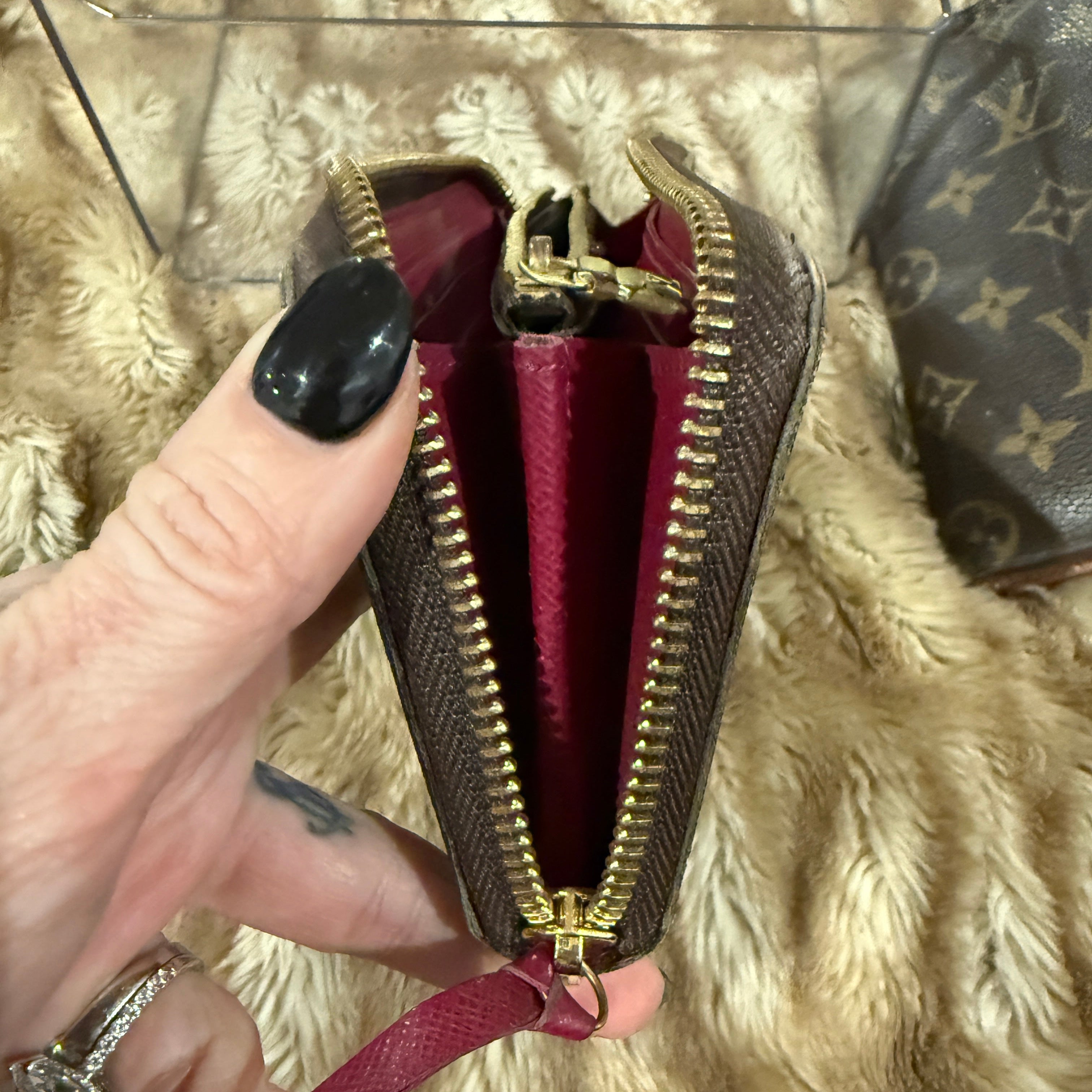 Louis Vuitton Zippy Wallet (Monogram Canvas) with a fuchsia/red interior.