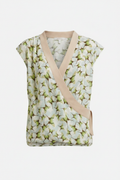 Cabi Butterfly green floral faux wrap top with nude panel on white background